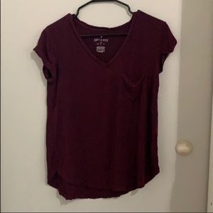 Maroon T-shirt.